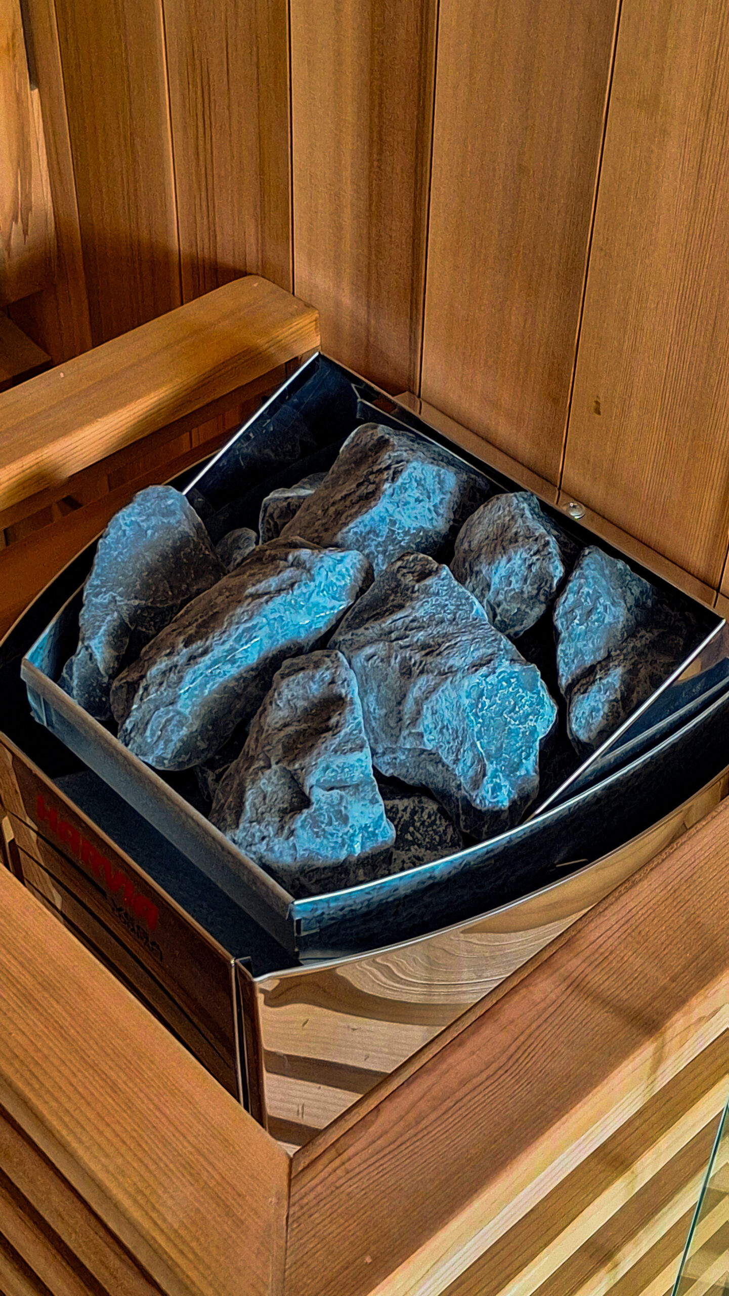 Close-up of the sauna stones inside the Harvia heater of a Solace Hybrid sauna